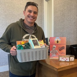 a man holding a basket of treats